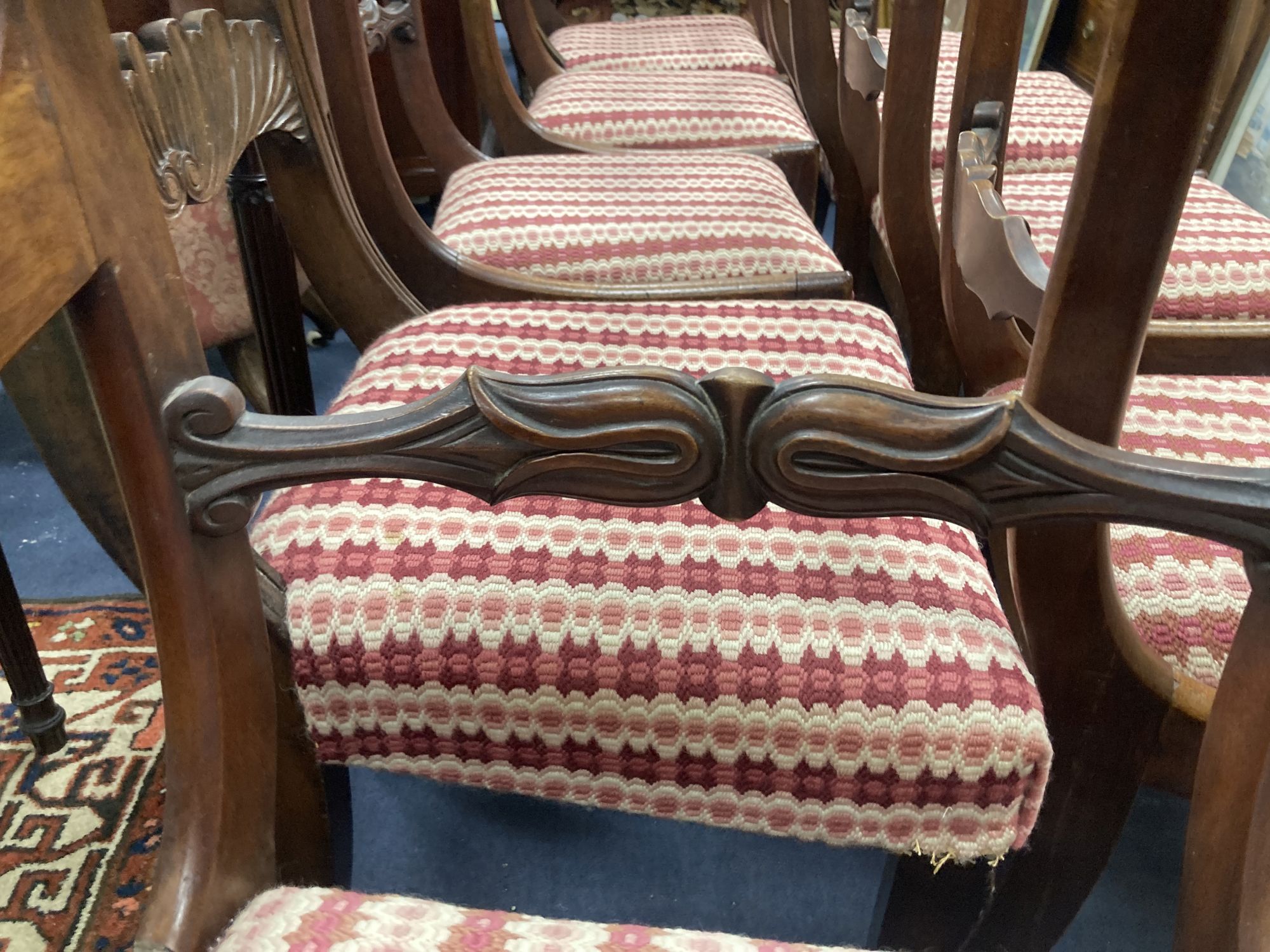 A harlequin set of nine George IV mahogany dining chairs (one having arms)